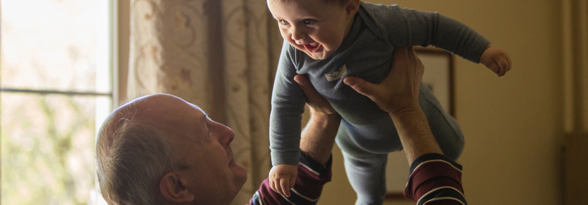 Grandfather holding his grandson