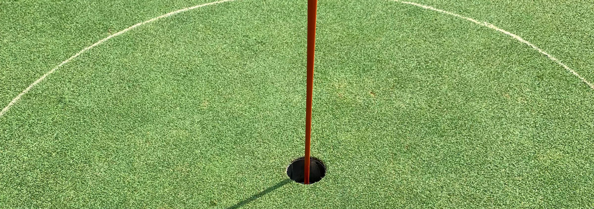 golf ball near hole