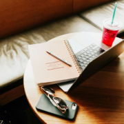 laptop sitting on a table in a coffee shop