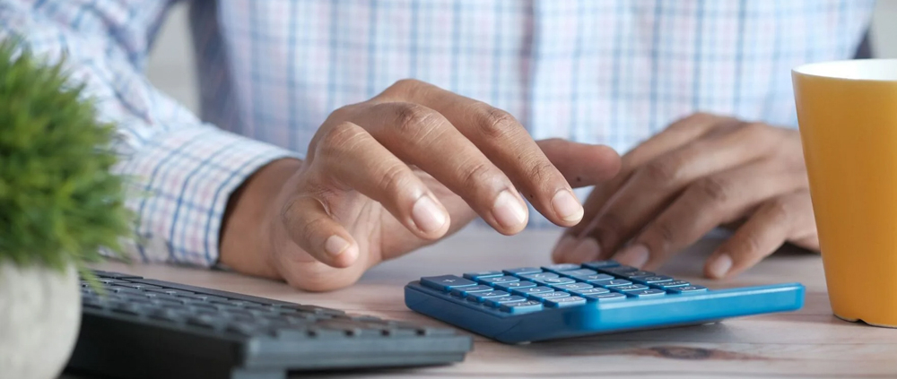 man using a calculator