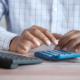 man using a calculator