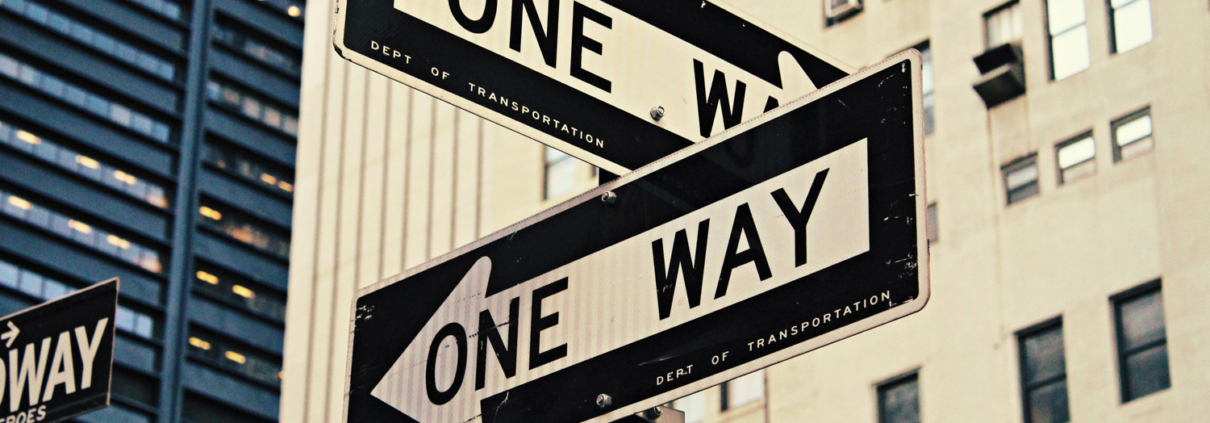 two signs displaying "one way"