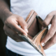 man holding an empty wallet