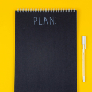 notebook displaying the words "plan"