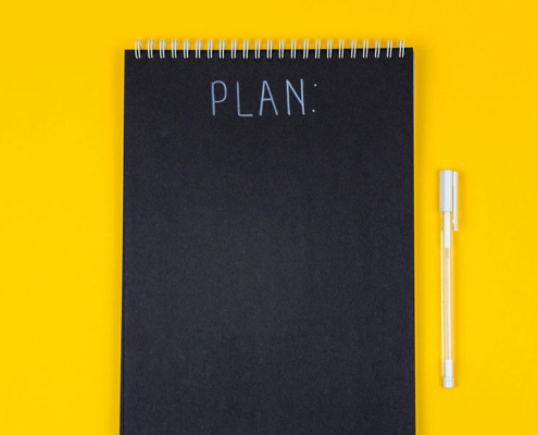 notebook displaying the words "plan"