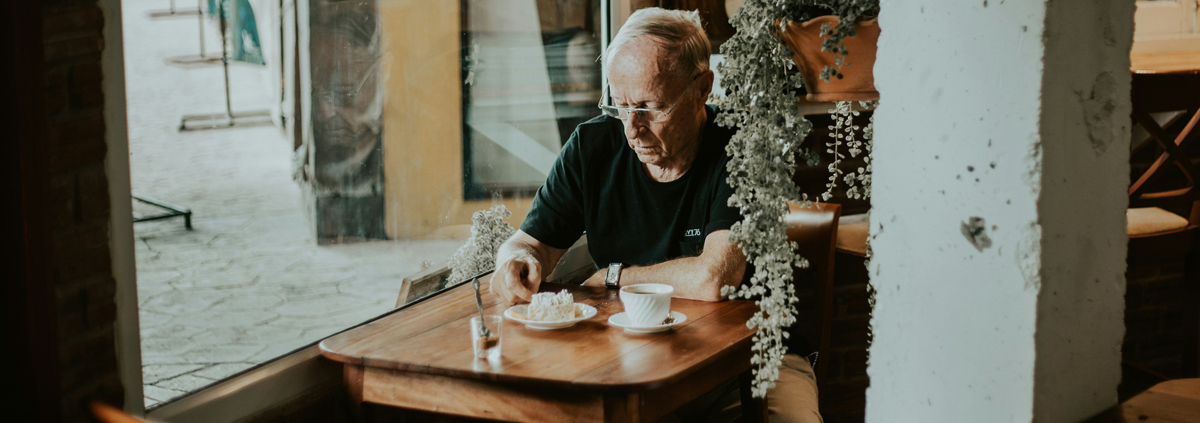 man sits alone at a table