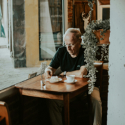 man sits alone at a table