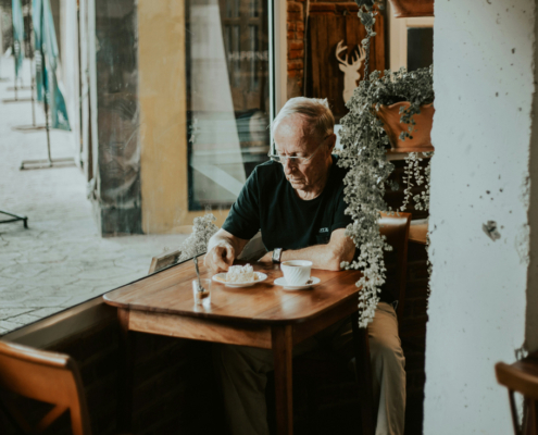man sits alone at a table