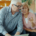 an elderly couple examines a credit card