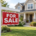 for sale sign in front of a home